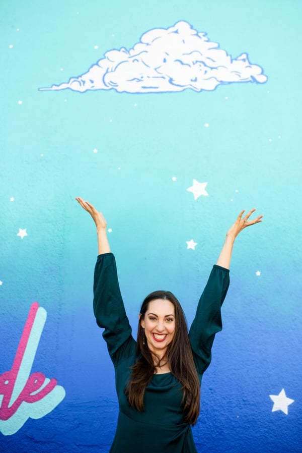 Vanessa Van Edwards with blue mural