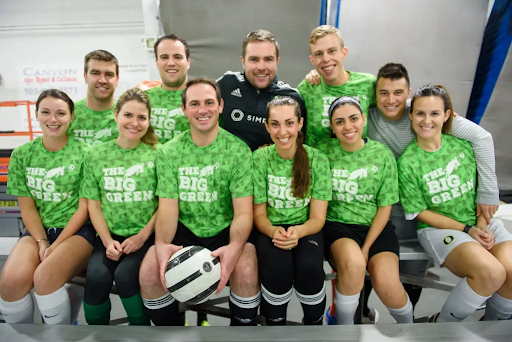 An image of Vanessa Van Edwards and all of her friends on a volleyball team, which relates to the article on how to make friends as an adult.