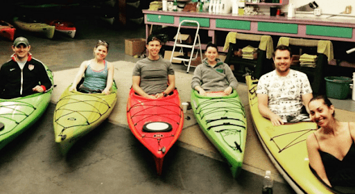 An image of Vanessa Van Edwards and all of her friends kayaking, which relates to the article on how to make friends as an adult.
