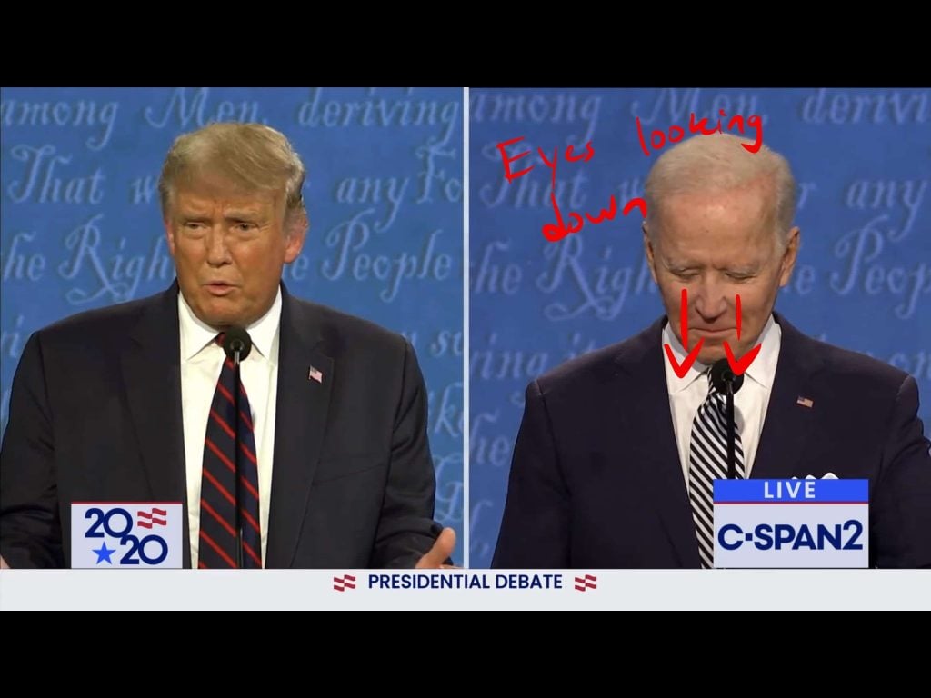 Biden looks down at his notes while Trump is talking
