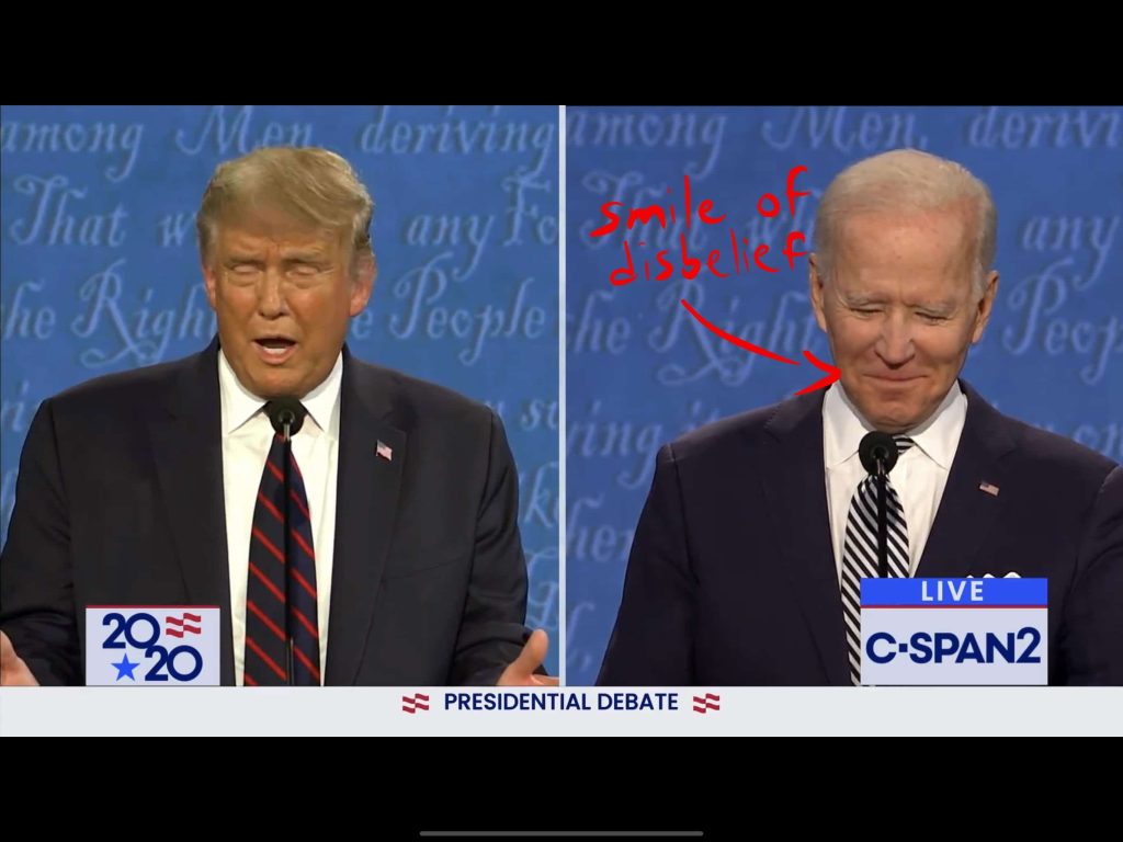 Biden smiles and shakes his head, disagreeing with Trump