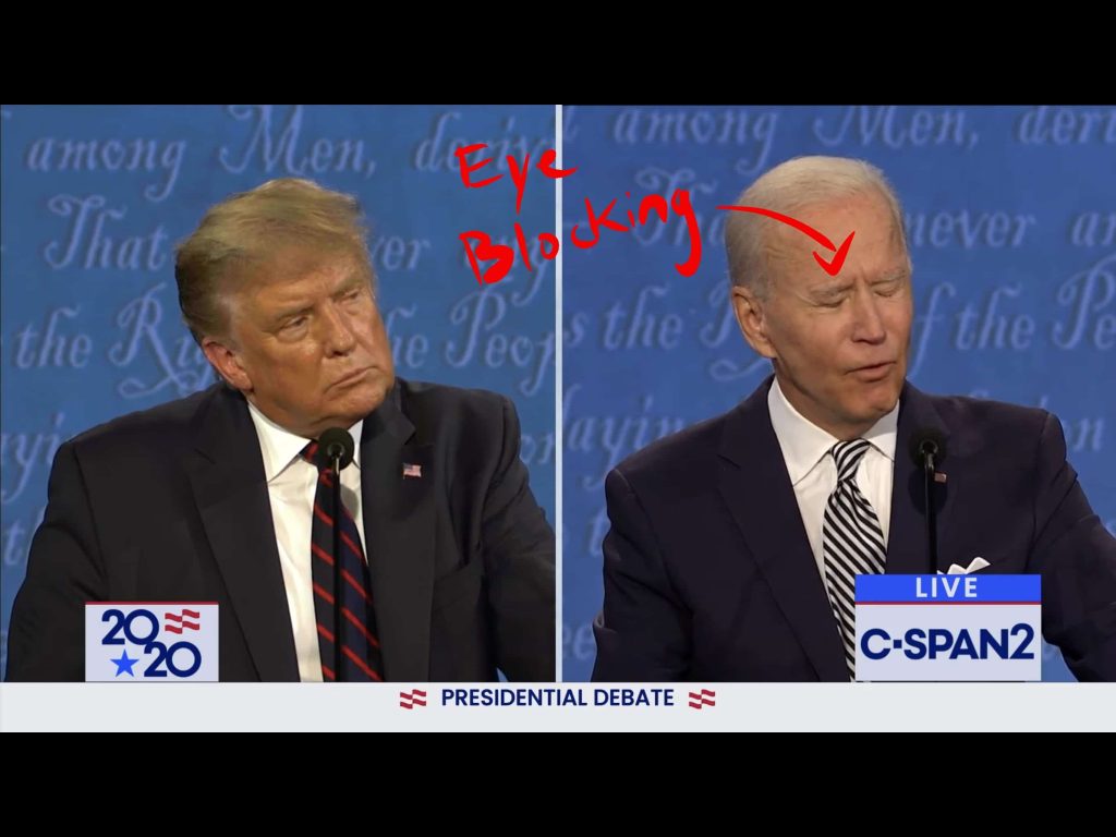 Biden does an eye blocking gesture by closing his eyes