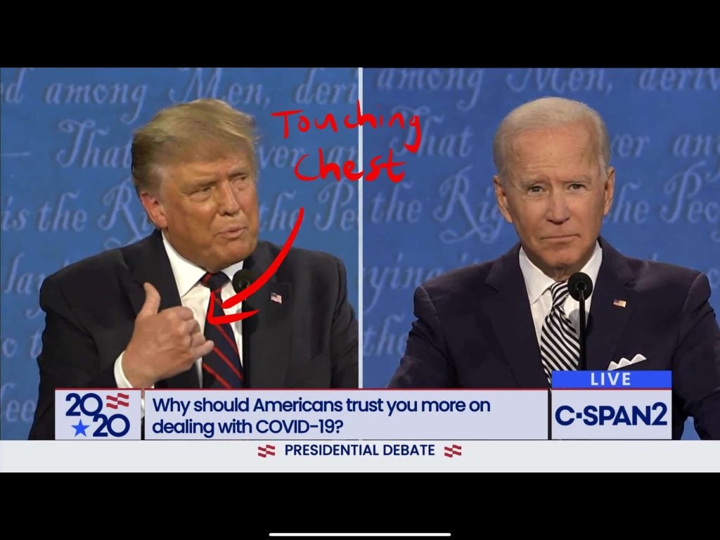 Trump touching his chest in a sincere gesture