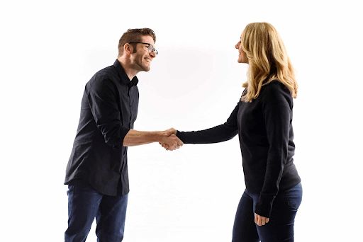 The equal handshake, which is one of many open body language examples