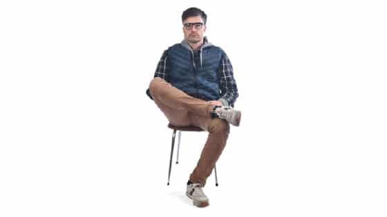 man sitting in a figure 4 legs position