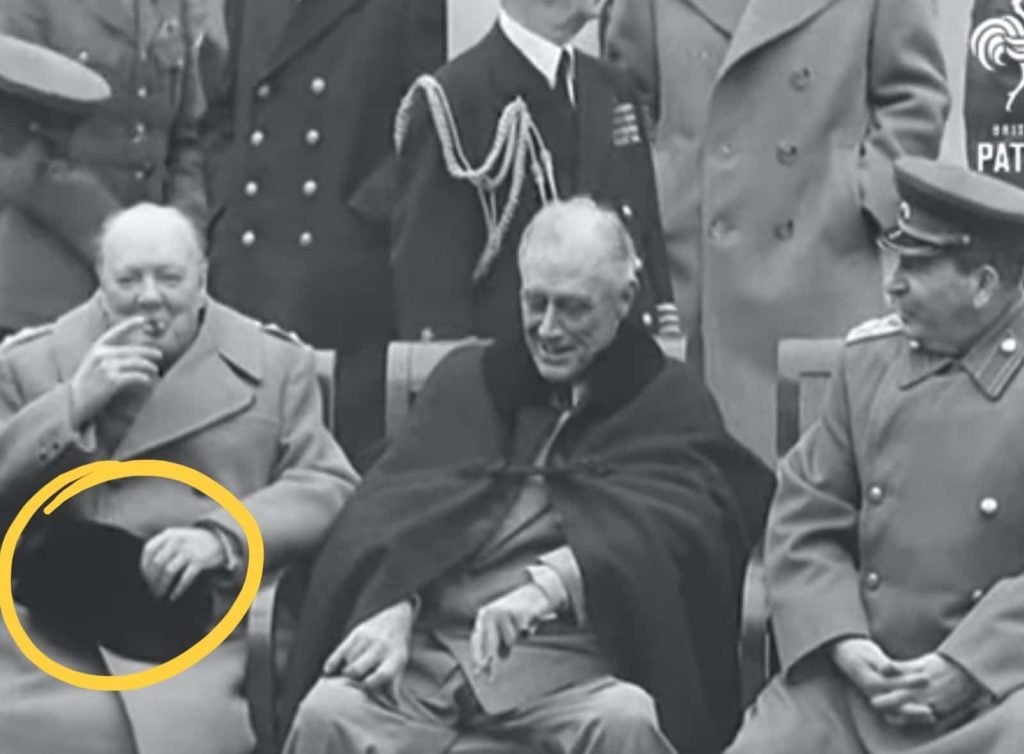 Churchill covering his private parts with his hat: