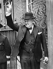 Winston Churchill making the a sign for victory during WWII