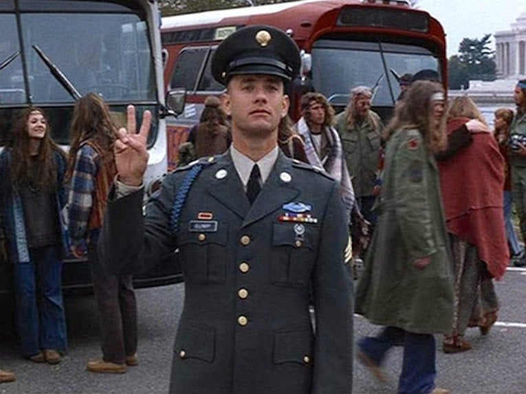 Tom Hanks throwing up the “Peace Sign” while doing the soldier stance in the movie, Forrest Gump