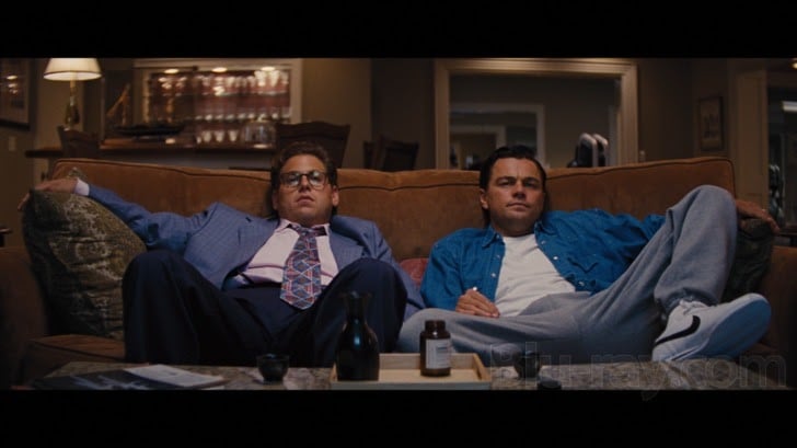 Jordan Belfort and Donnie Azoff spreading their legs wide in the movie The Wolf of Wall Street