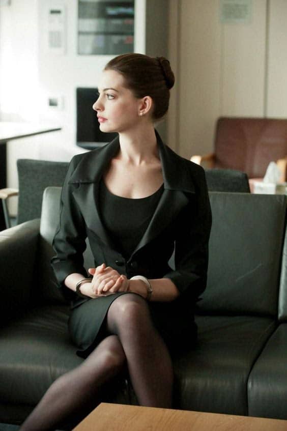 Anne Hathaway crossing her legs