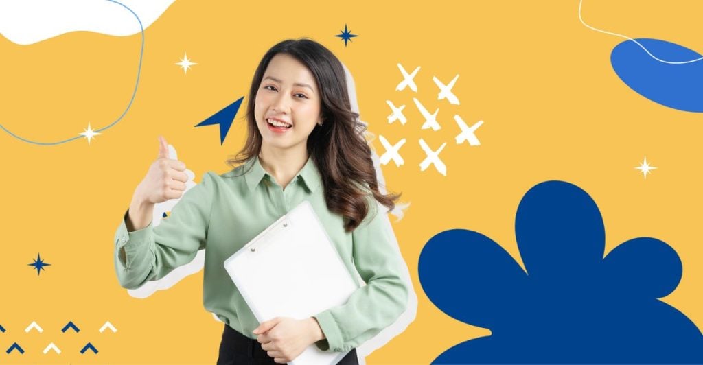 An image of a woman in work clothes with her thumbs up smiling, holding a clipboard to her chest. This relates to the article on the happiest jobs in the world.