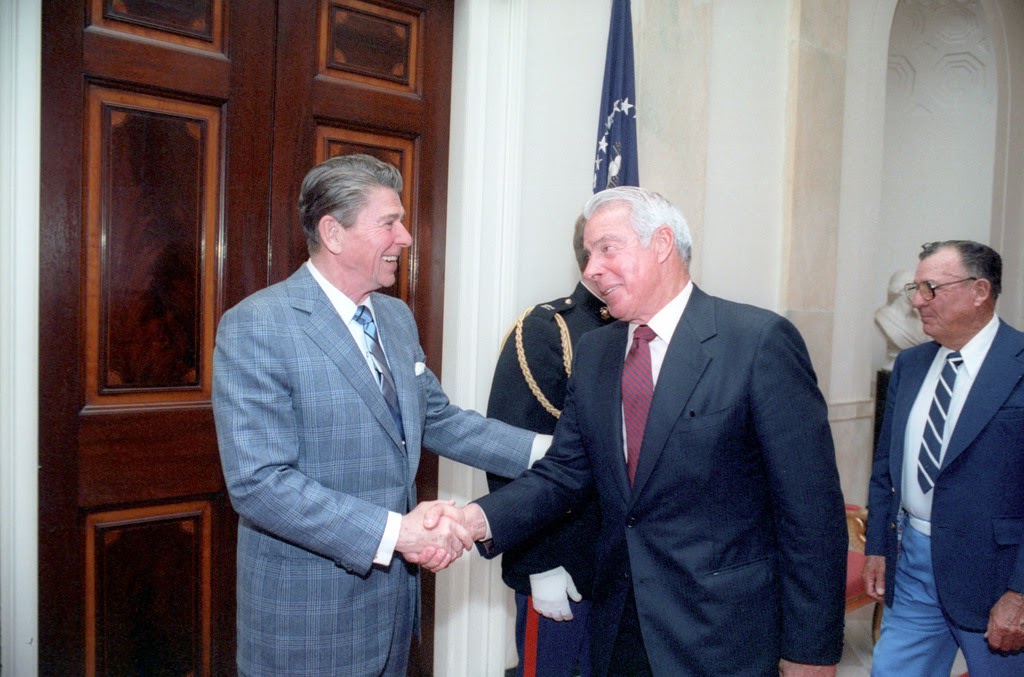 Image of President Ronald Reagan getting the “one-up” on Joe DiMaggio