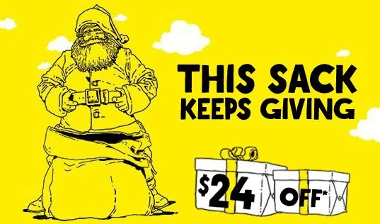 Spirit airlines ad image showing santa with a large sack between his legs