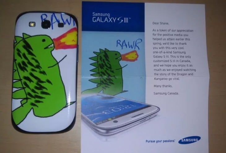 A Samsung S3 phone with a dragon drawing on it