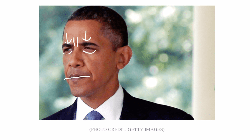 Barack Obama furrowing his brow, hardening his eyelids, and pursing his lips.