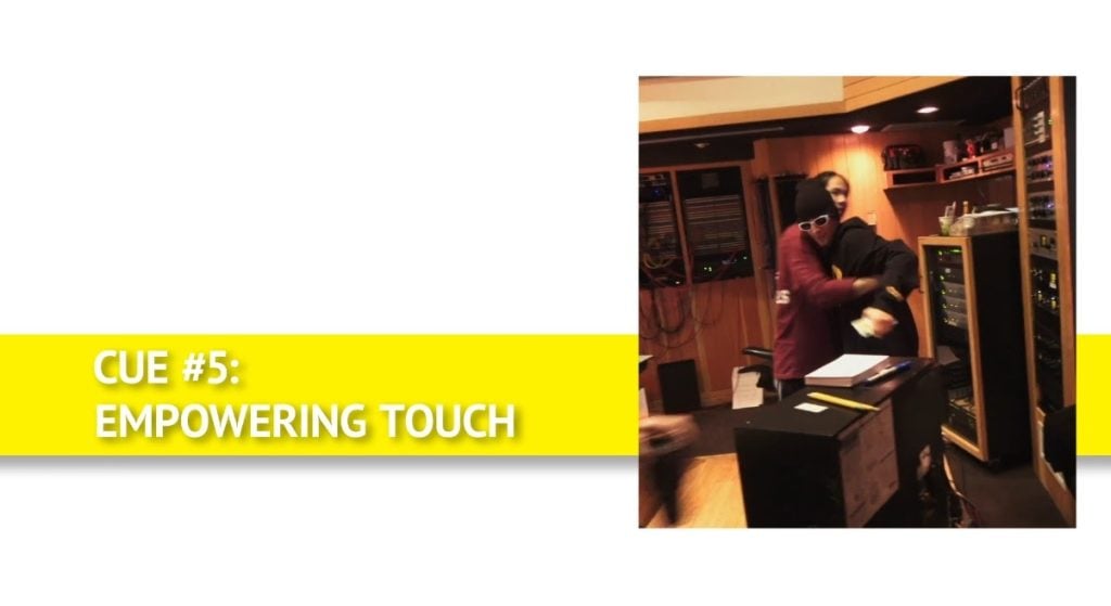 Justin Bieber body language cue #5: empowering touch