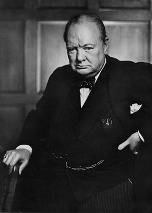 A black and white image of Winston Churchill, a wartime leader and former Prime Minister of the United Kingdom