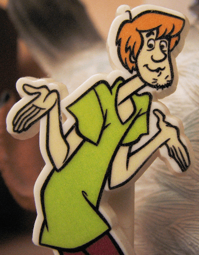 An image of Shaggy from scooby doo. Most people remember him having an adam's apple, but he doesn't, which is an example of the mandela effect.