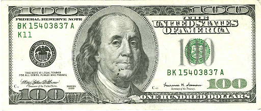 An image of Ben Franklin on a bill. Most people remember him being president, but he never was, which is an example of the mandela effect.