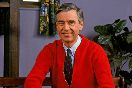 An image of Mr. Roger's. While we all remember his theme song as, “It’s a beautiful day in the neighborhood,” the lyrics are actually, “It’s a beautiful day in this neighborhood.” This demonstrates the mandela effect.