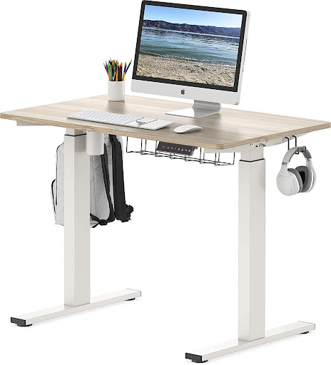 An image of a standing desk which can be beneficial for decreasing the health risks of sitting all day and where office exercises can be done