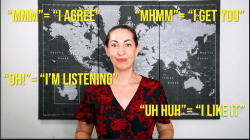 Vanessa Van Edwards showing how "vocal cues" like mmhmm, oooh, and aha, add warmth and can help you approach a new group of people.