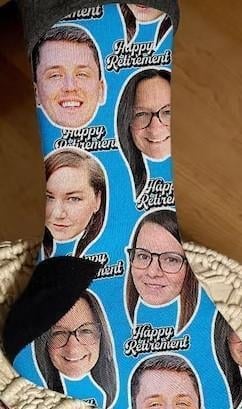 An image of one of many retirement gift ideas, custom socks with your coworkers faces from Etsy