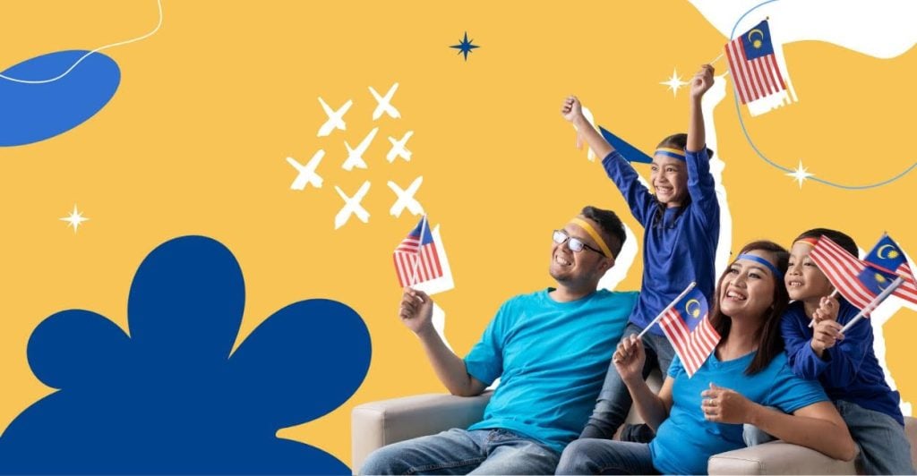 A family waving a bunch of flags looking happy.