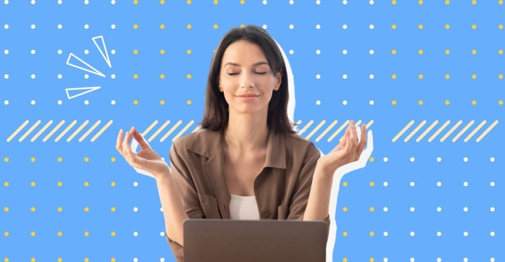 A woman with her palms up sitting at her computer desk. She looks like she is meditating as she has her eyes closed and face appears relaxed. This relates to the article on coping skills.