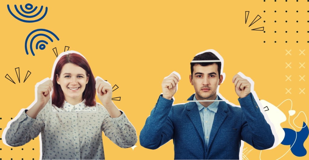 A smiling woman and a serious-looking man stand side by side against a yellow background, each raising both hands as if mimicking a celebratory pose.